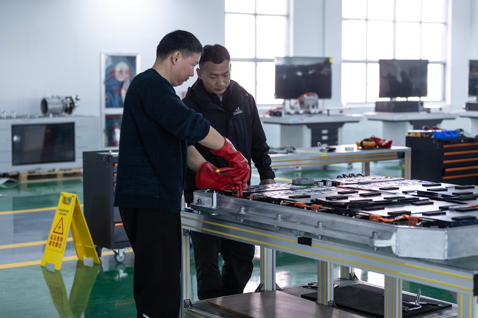 BTKX engineers inspecting a battery training system