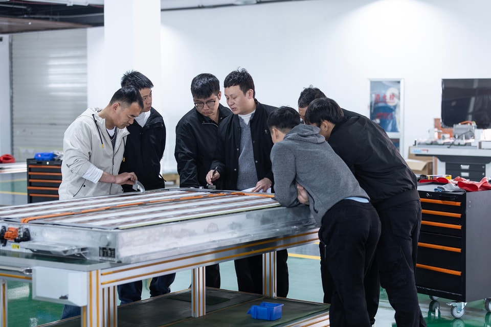 BTKX engineering team working on an automotive training system